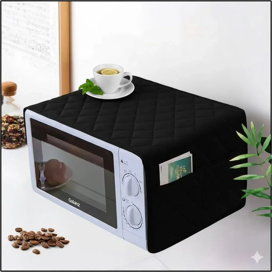 Black quilted microwave cover with side pocket, protecting white Galanz microwave in kitchen setting