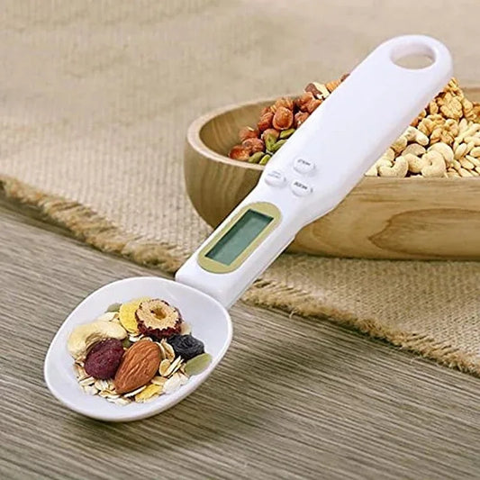 Digital kitchen scale spoon with mixed nuts and dried fruits, ideal for precise food portioning